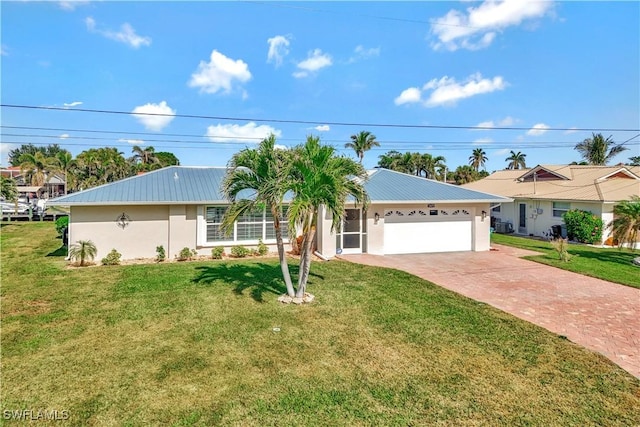 ranch-style house with a garage and a front yard