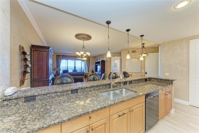 kitchen featuring light brown cabinetry, sink, crown molding, dark stone countertops, and black dishwasher