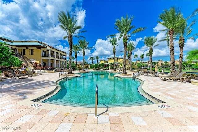 view of swimming pool featuring a patio area