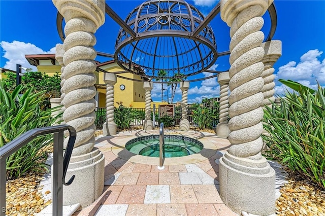 view of patio / terrace featuring a community hot tub