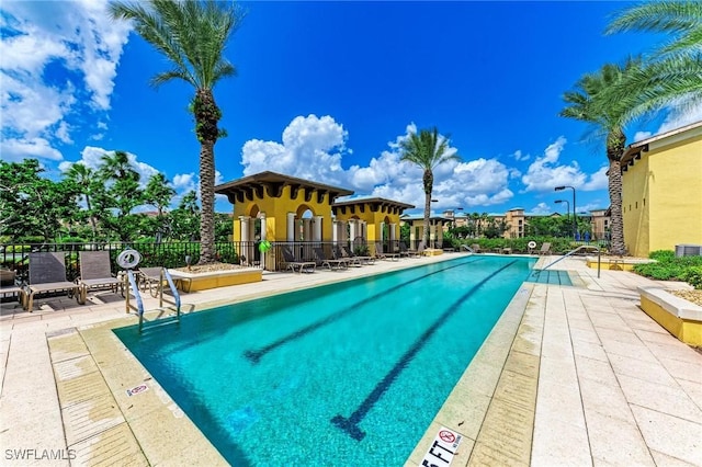 view of swimming pool featuring a patio area