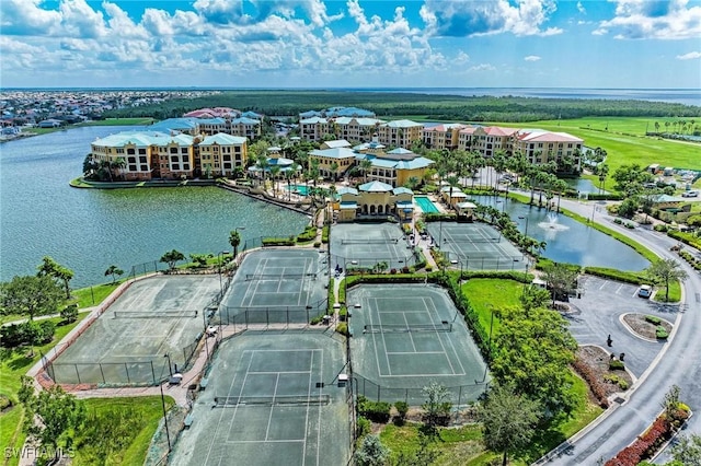 birds eye view of property with a water view