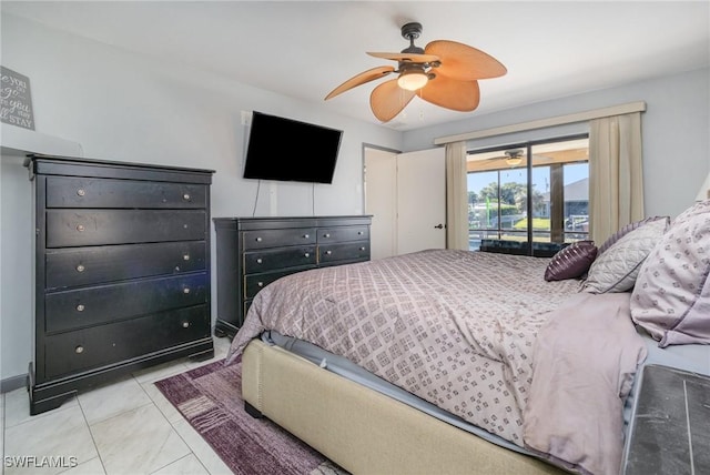 tiled bedroom with ceiling fan and access to outside