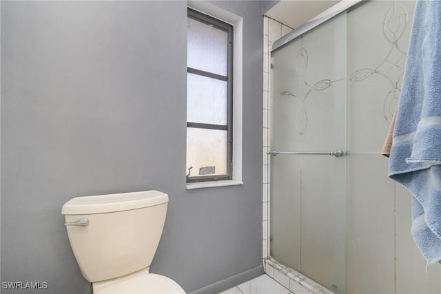 bathroom featuring walk in shower and toilet