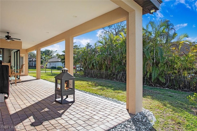 view of patio featuring ceiling fan