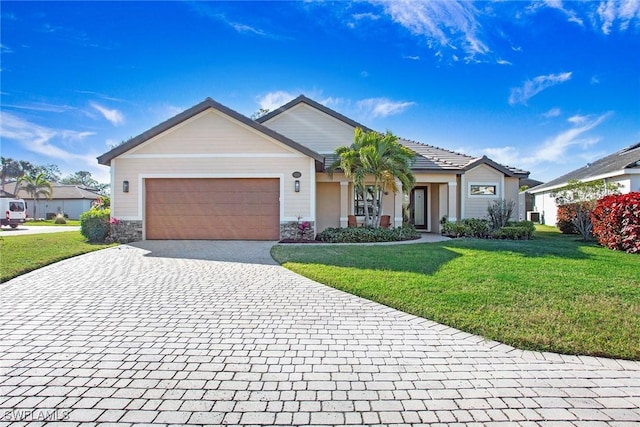 ranch-style home with a garage and a front lawn