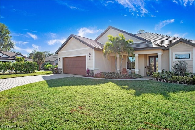 ranch-style home with a garage and a front yard