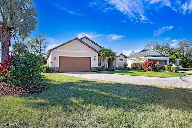 single story home with a garage and a front lawn