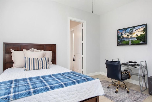 bedroom with light wood-type flooring