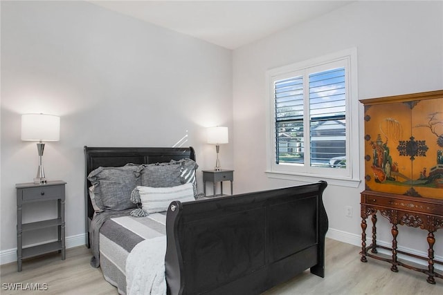 bedroom with light hardwood / wood-style floors