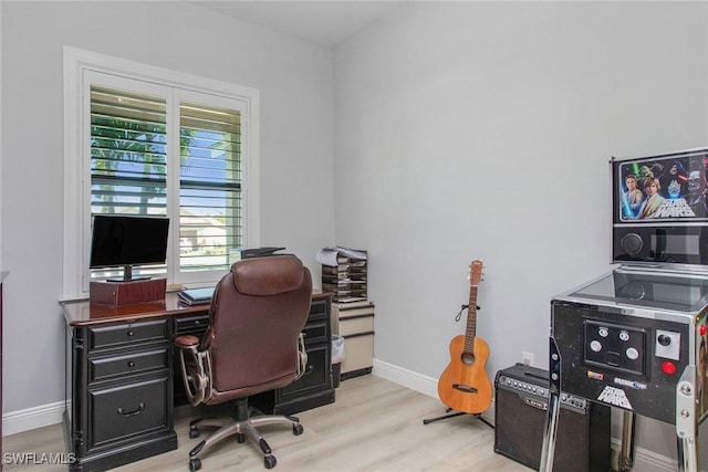 office space with light hardwood / wood-style floors