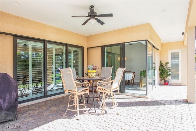 view of patio featuring grilling area and ceiling fan