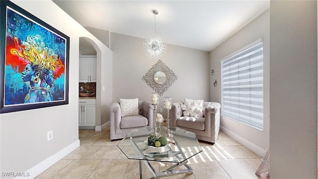 sitting room with light tile patterned flooring and a healthy amount of sunlight