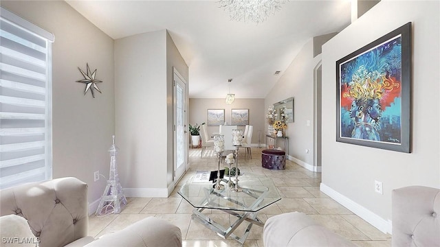 living room featuring lofted ceiling and light tile patterned floors