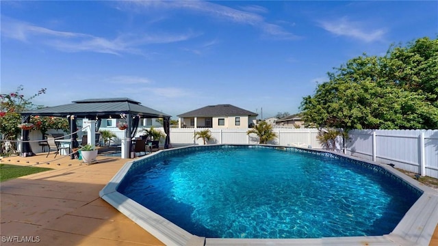 view of swimming pool featuring a gazebo