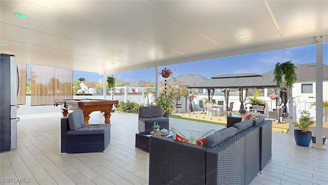 view of patio featuring an outdoor living space and a gazebo