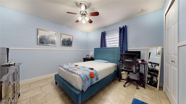 bedroom with light tile patterned floors and ceiling fan