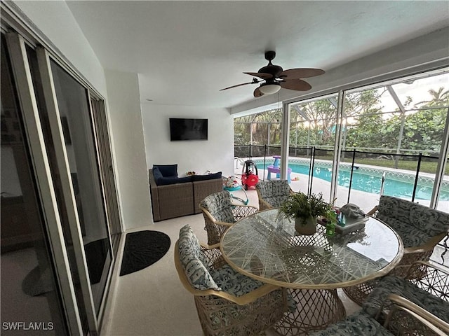 sunroom / solarium with ceiling fan