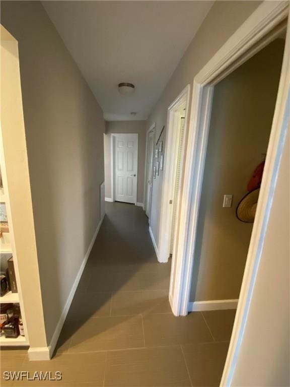 corridor featuring tile patterned flooring