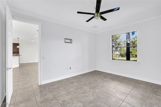 tiled empty room featuring crown molding and ceiling fan