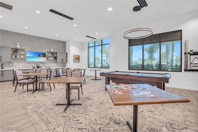 rec room with light wood-type flooring and billiards