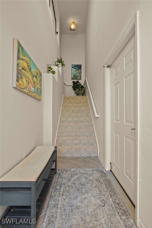 hallway featuring tile patterned flooring