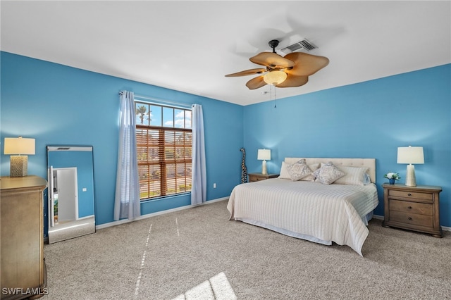 bedroom with ceiling fan and carpet