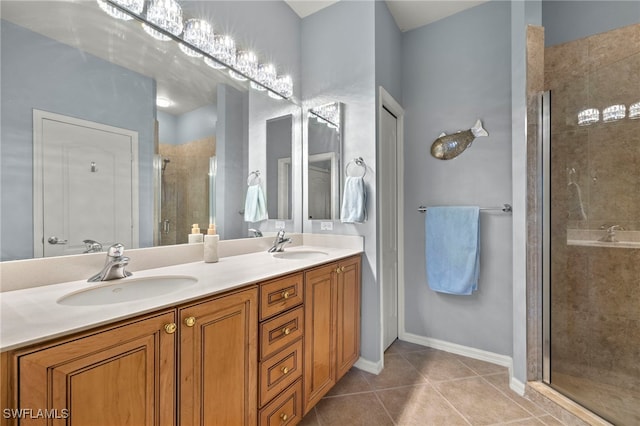 bathroom with vanity, tile patterned floors, and a shower with shower door