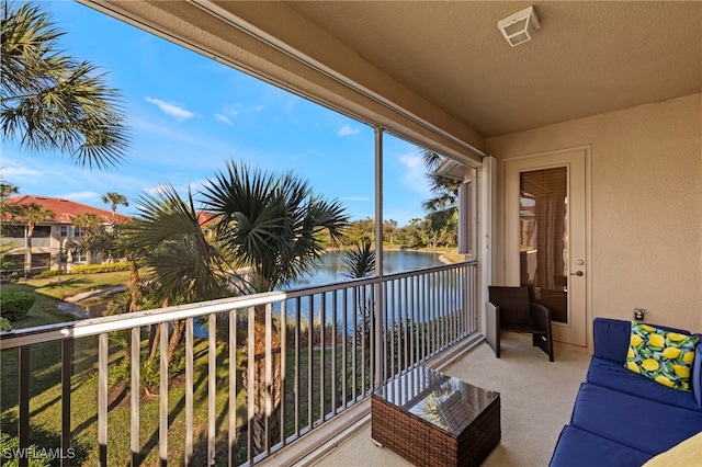 balcony featuring a water view