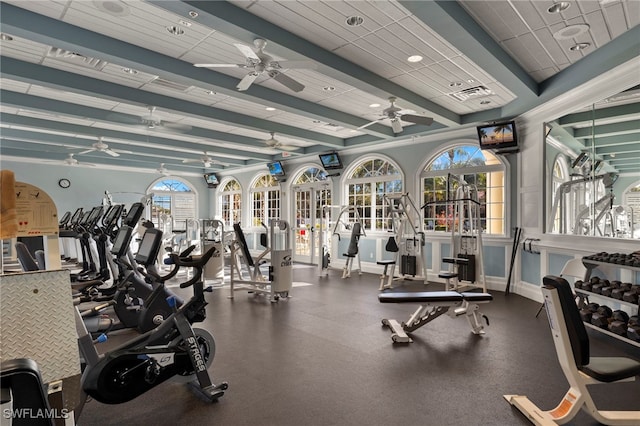 workout area with a drop ceiling and ceiling fan