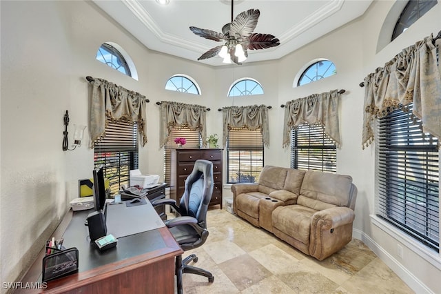 office space with a wealth of natural light, ornamental molding, and ceiling fan