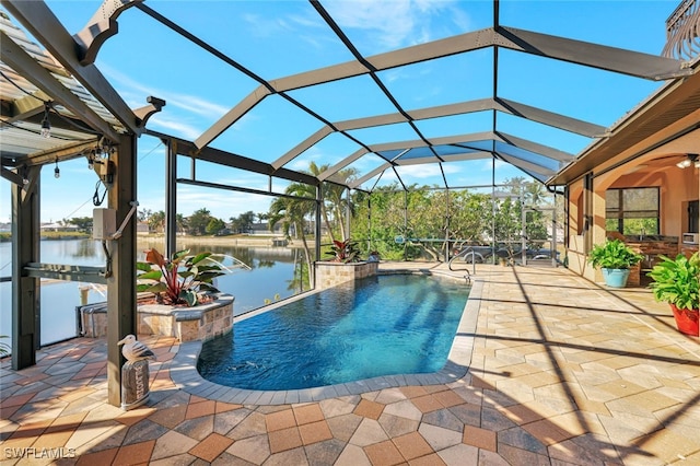 view of swimming pool featuring a lanai, a patio, and a water view