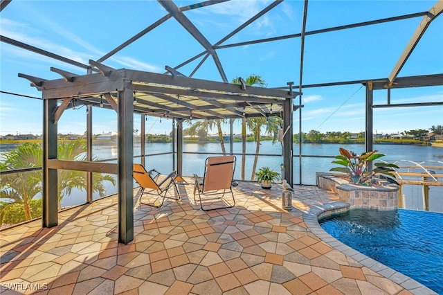 view of patio / terrace featuring a water view and pool water feature