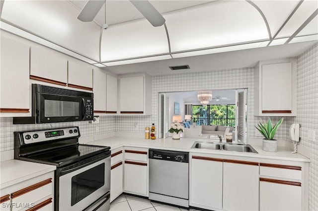 kitchen featuring white cabinetry, sink, decorative backsplash, and stainless steel appliances