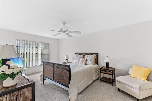 bedroom with ceiling fan and light colored carpet