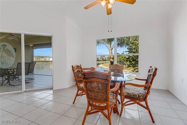 dining room with light tile patterned floors and ceiling fan