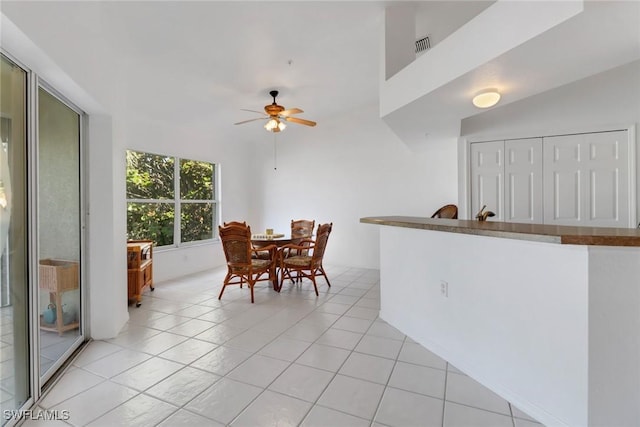 dining room featuring light tile patterned floors and ceiling fan