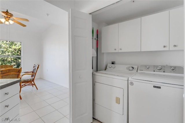 washroom featuring cabinets, separate washer and dryer, light tile patterned floors, and ceiling fan