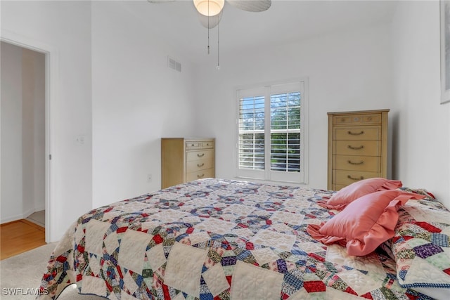 bedroom featuring hardwood / wood-style flooring and ceiling fan