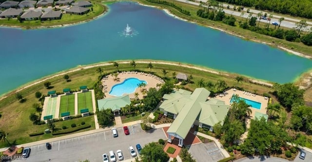 birds eye view of property with a water view