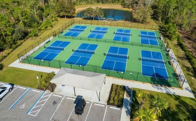 birds eye view of property with a water view