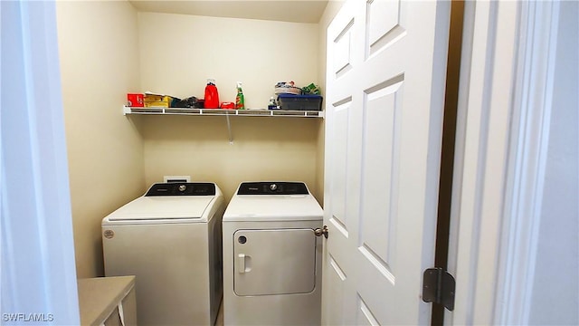 laundry room featuring washing machine and dryer