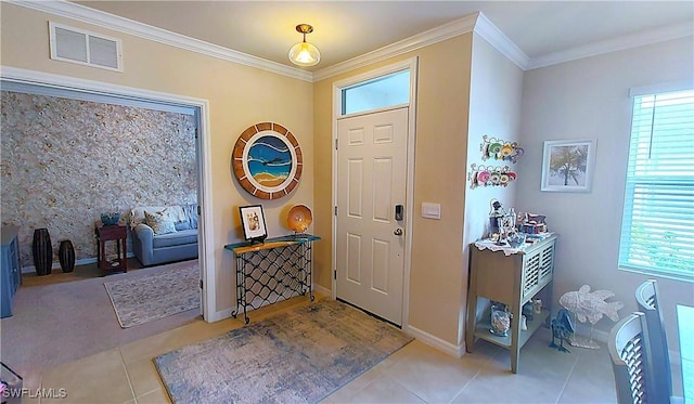 entrance foyer featuring light tile patterned flooring and ornamental molding