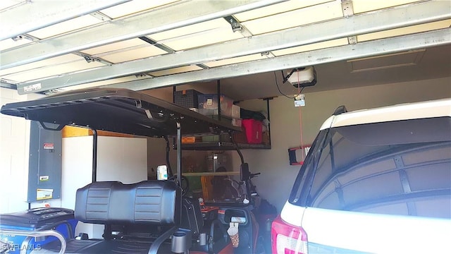 garage featuring a garage door opener