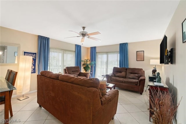 living room featuring ceiling fan and light tile patterned flooring