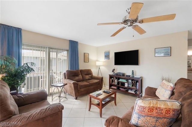 tiled living room featuring ceiling fan