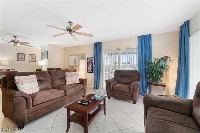 tiled living room with ceiling fan