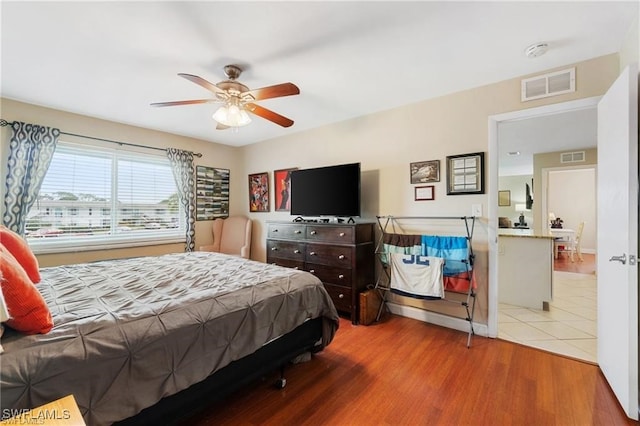 bedroom featuring light hardwood / wood-style flooring and ceiling fan