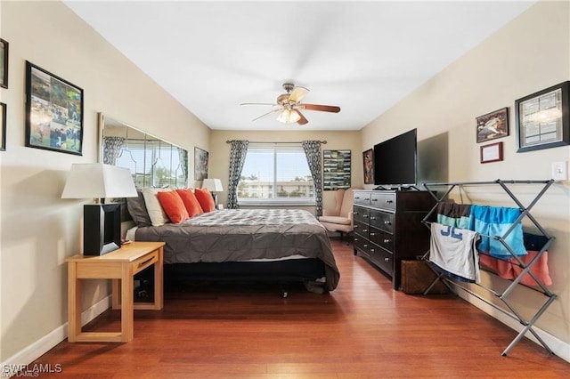 bedroom featuring wood-type flooring and ceiling fan