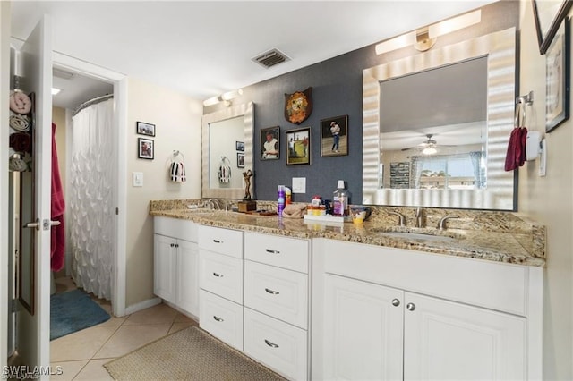 bathroom featuring tile patterned flooring and vanity